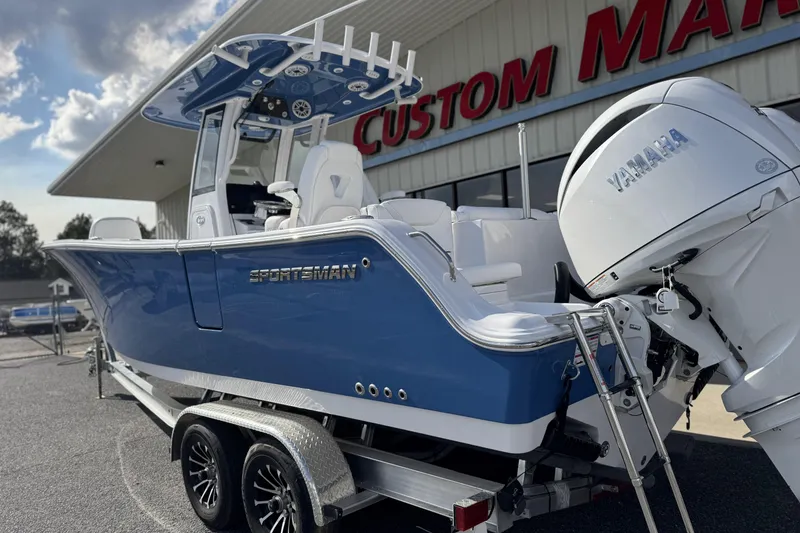 Slide: The Image of 2026 Sportsman Heritage 261 Center Console boat with Yamaha engine at dealership. - 7