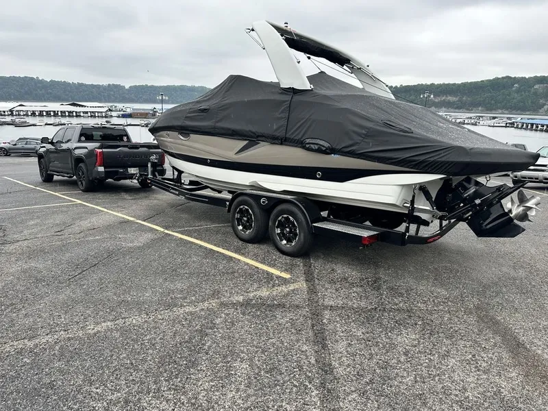 Slide: The Image of 2022 Crownline 265 SS boat on trailer, ready for transport. - 10