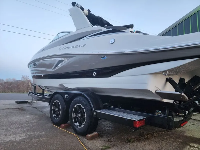 Slide: The Image of 2022 Crownline 265 SS boat on trailer, side view. - 11