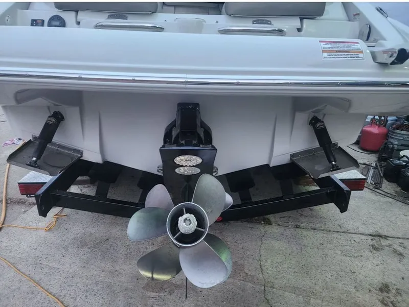 Slide: The Image of Rear view of a 2022 Crownline 265 SS boat with propeller. - 14