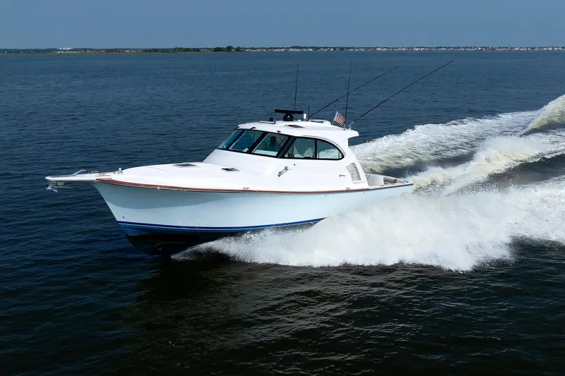 The Image of 2023 Henriques 42 Express Hardtop cruising on open water, showcasing sleek design and performance. - 0