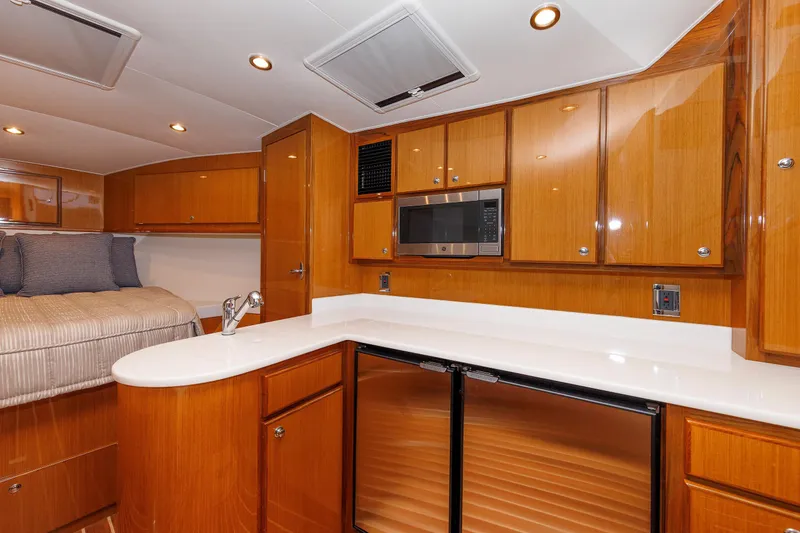Slide: The Image of Luxurious interior of 2023 Henriques 42 Express Hardtop yacht with modern kitchen amenities. - 47