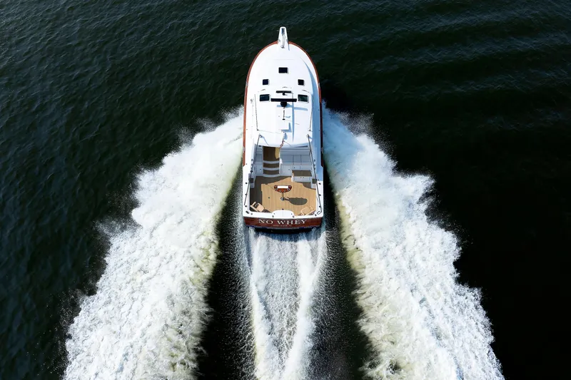 Slide: The Image of 2023 Henriques 42 Express Hardtop cruising on open water, aerial view. - 6