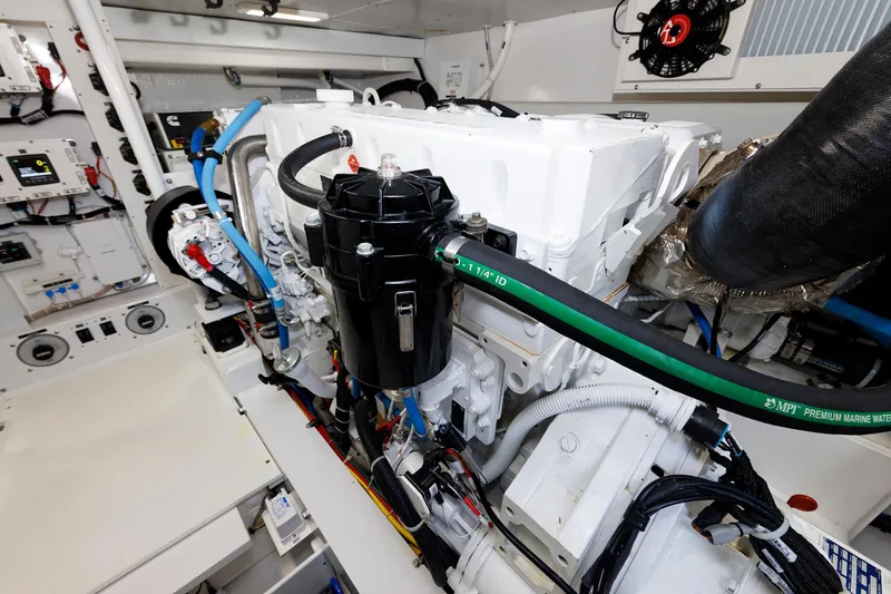 Slide: The Image of Engine room of 2023 Henriques 42 Express Hardtop, showcasing detailed mechanical components. - 64