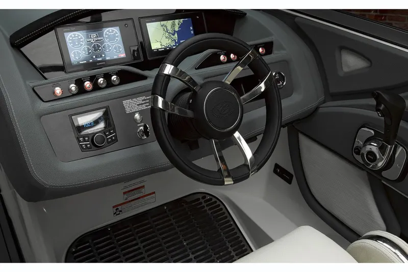 Slide: The Image of Manufacturer Provided Image: 2019 Cobalt R5 boat dashboard with steering wheel and navigation controls. - 11