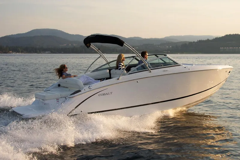 Slide: The Image of Manufacturer Provided Image: 2019 Cobalt R5 boat cruising on a lake with passengers enjoying the ride. - 4