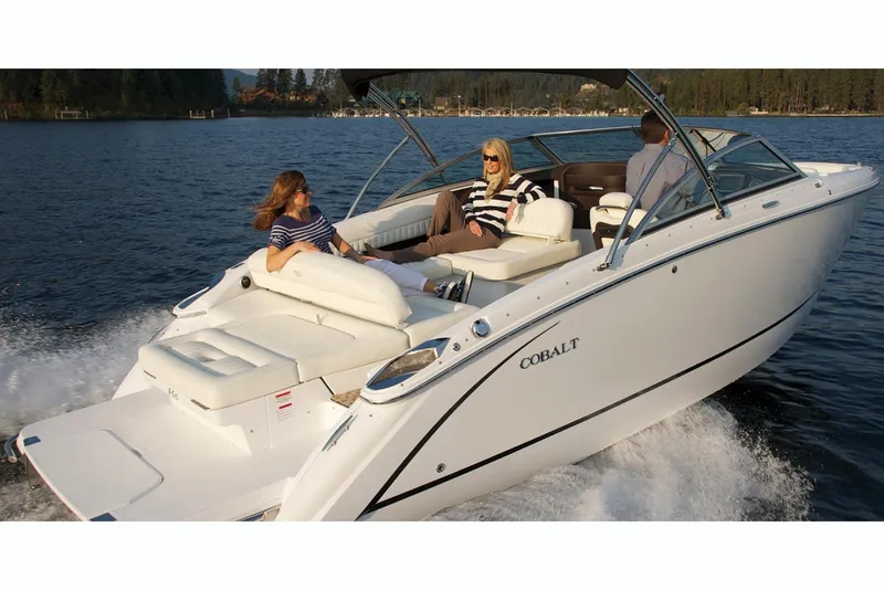 Slide: The Image of Manufacturer Provided Image: 2019 Cobalt R5 boat cruising on a lake with passengers relaxing. - 5