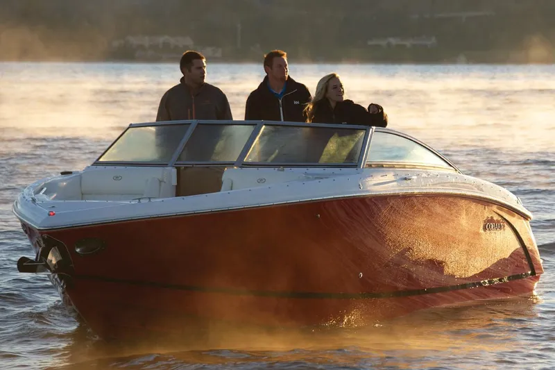 Slide: The Image of Manufacturer Provided Image: 2019 Cobalt R5 boat with three people on a misty lake. - 7