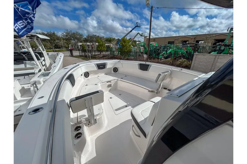 Slide: The Image of 2025 Robalo R300 Center Console boat with spacious seating and modern design. - 10