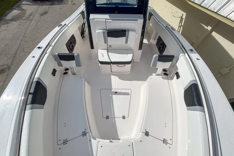 Slide: The Image of 2025 Robalo R300 Center Console boat interior with seating and storage compartments. - 12