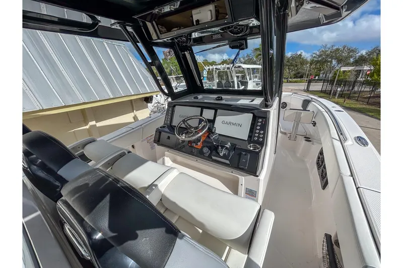 Slide: The Image of 2025 Robalo R300 Center Console boat interior with Garmin navigation system. - 4