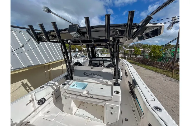 Slide: The Image of 2025 Robalo R300 Center Console boat with sleek design and modern features. - 5