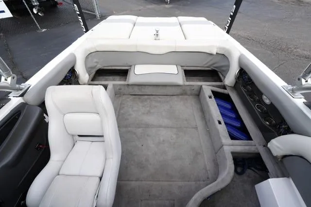 Slide: The Image of 2006 Supra Launch 20 SSV boat interior with white seating and storage compartments. - 15