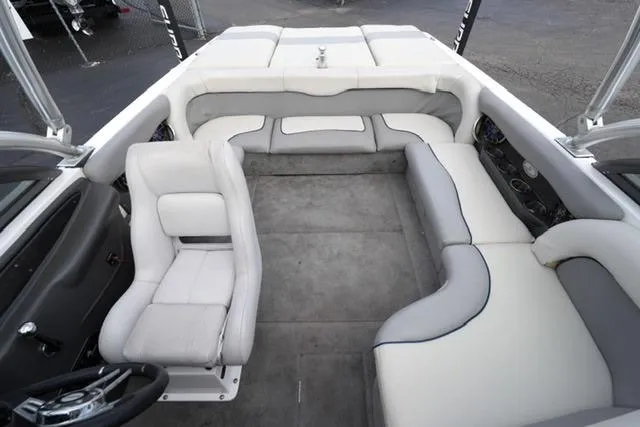 Slide: The Image of 2006 Supra Launch 20 SSV boat interior with white and gray seating arrangement. - 16
