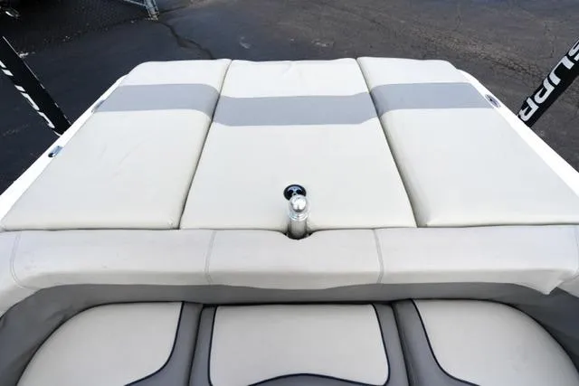 Slide: The Image of 2006 Supra Launch 20 SSV boat with cushioned seating and sleek design. - 17