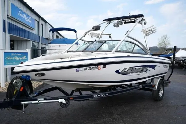 Slide: The Image of 2006 Supra Launch 20 SSV boat on trailer, parked outside dealership. - 22