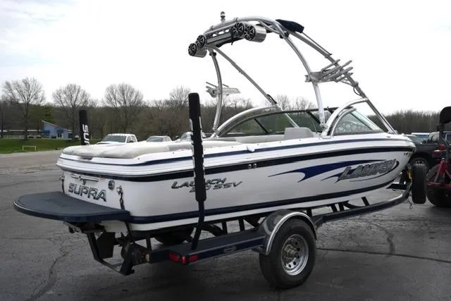 Slide: The Image of 2006 Supra Launch 20 SSV boat on trailer, featuring wakeboard tower and sleek design. - 25