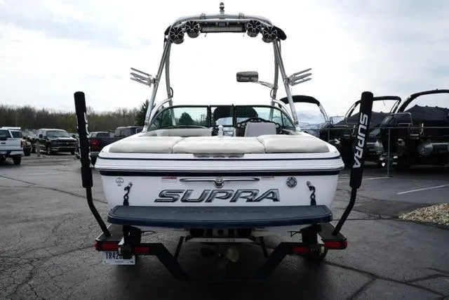 Slide: The Image of 2006 Supra Launch 20 SSV boat, rear view, parked on a trailer in a lot. - 5