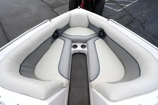 Slide: The Image of 2006 Supra Launch 20 SSV boat interior with cushioned seating and cup holders. - 8