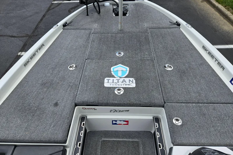 Slide: The Image of 2015 Skeeter FX20 boat deck with Titan Tungsten logo and storage compartments. - 18