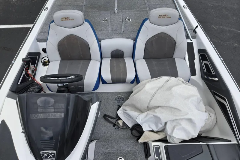 Slide: The Image of 2015 Skeeter FX20 boat interior with dual seats and steering console. - 21