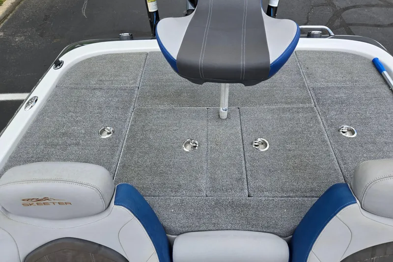 Slide: The Image of 2015 Skeeter FX20 boat deck with seating and storage compartments. - 23