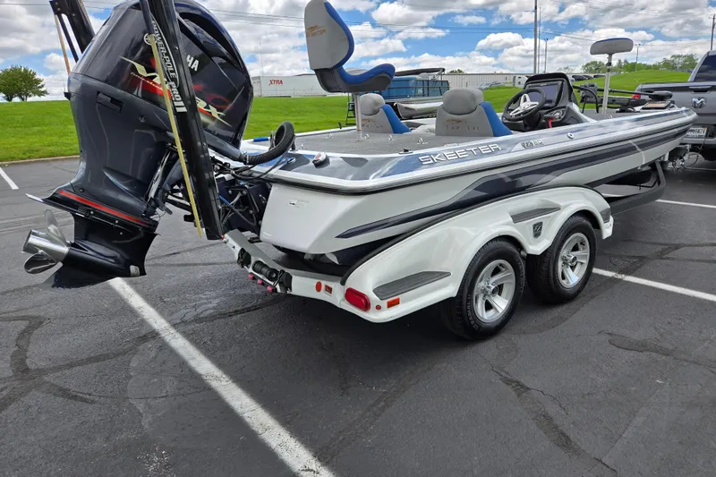 Slide: The Image of 2015 Skeeter FX20 boat with Yamaha outboard motor in parking lot. - 3