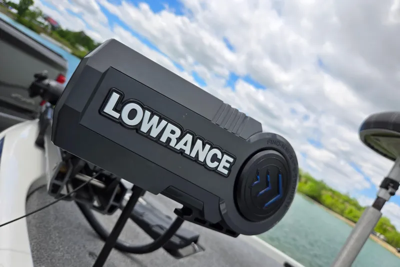 Slide: The Image of Lowrance device on 2015 Skeeter FX20 boat, with scenic lake background. - 9
