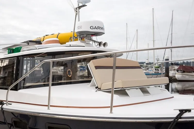 Slide: The Image of Manufacturer Provided Image: 2025 Ranger Tugs R-27 boat with Garmin equipment, docked at marina. - 9