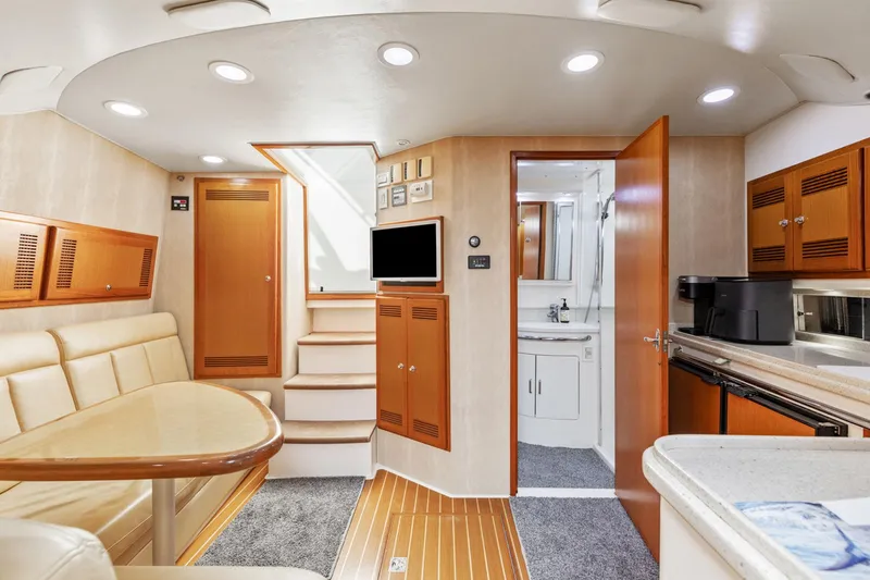 Slide: The Image of Luxurious interior of a 2004 Cabo 40 Express yacht with modern amenities. - 20