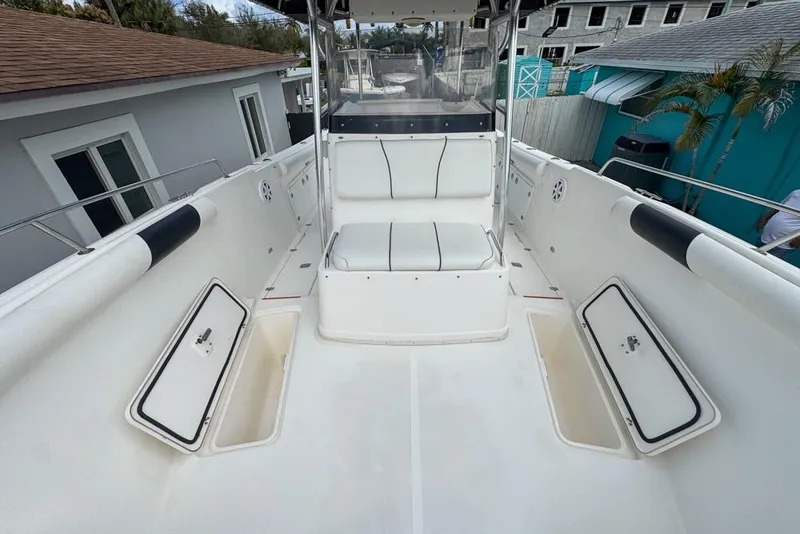 Slide: The Image of 2000 Century 3200 Center Console boat interior with seating and storage compartments. - 102