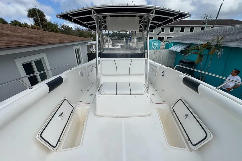 Slide: The Image of 2000 Century 3200 Center Console boat with open storage compartments and seating. - 103