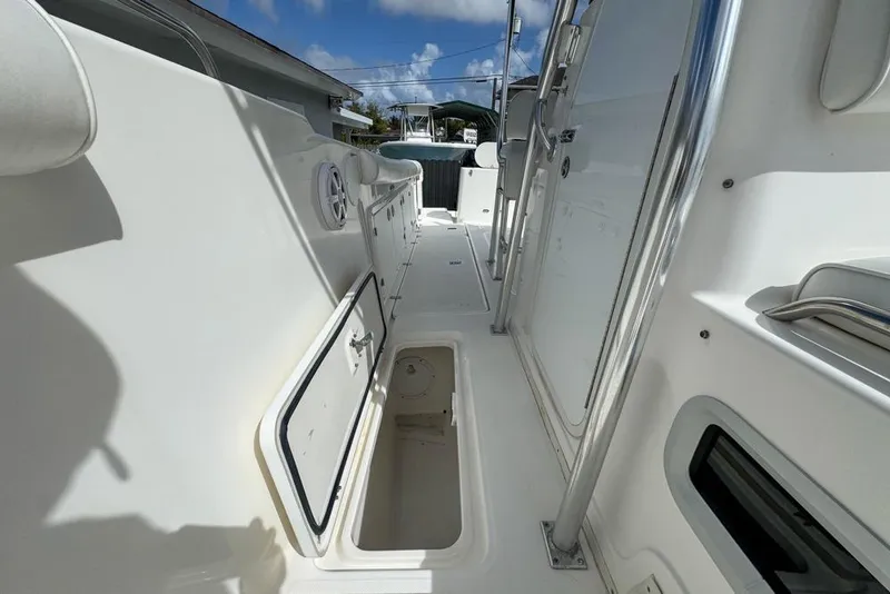 Slide: The Image of 2000 Century 3200 Center Console boat interior with open storage compartment. - 108