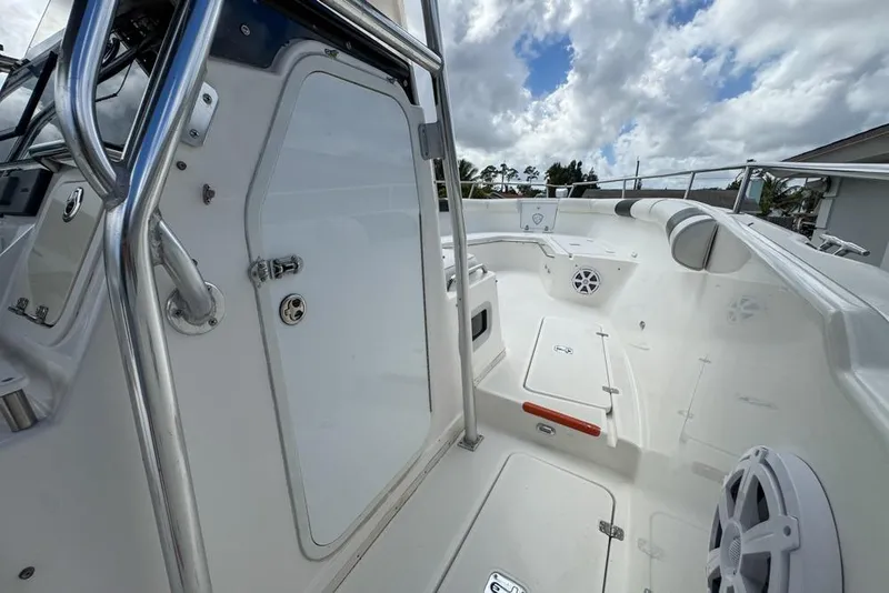 Slide: The Image of 2000 Century 3200 Center Console boat interior with stainless steel features and storage compartments. - 109