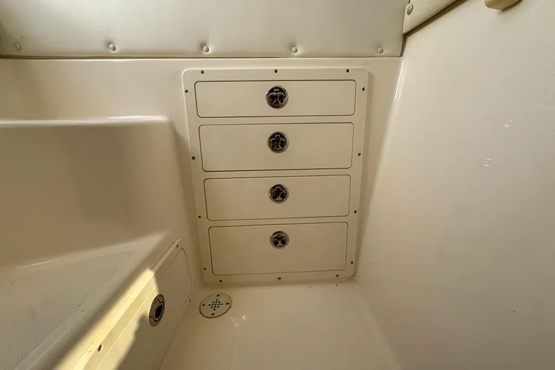 Slide: The Image of Interior storage drawers on a 2000 Century 3200 Center Console boat. - 117