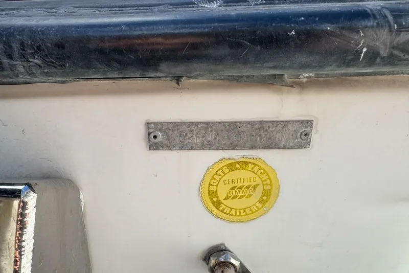 Slide: The Image of 2000 Century 3200 Center Console boat with certification sticker and identification plate. - 122