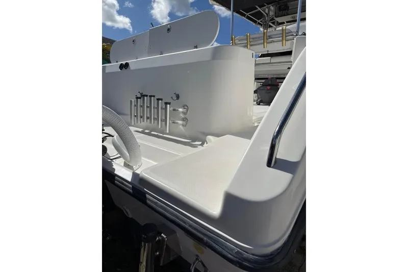 Slide: The Image of Aerial view of a 2000 Century 3200 Center Console boat parked beside a house. - 14