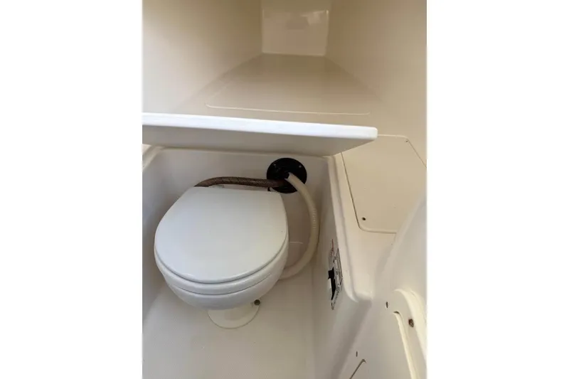 Slide: The Image of Aerial view of a 2000 Century 3200 Center Console boat parked beside houses. - 15