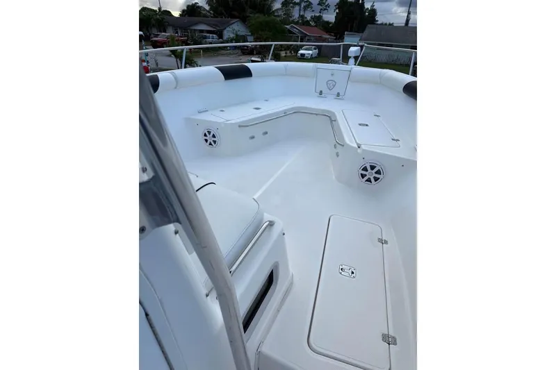 Slide: The Image of 2000 Century 3200 Center Console boat parked between houses, aerial view. - 19