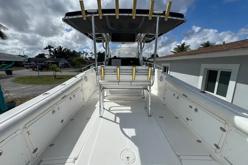 Slide: The Image of 2000 Century 3200 Center Console boat with spacious deck and rod holders. - 21