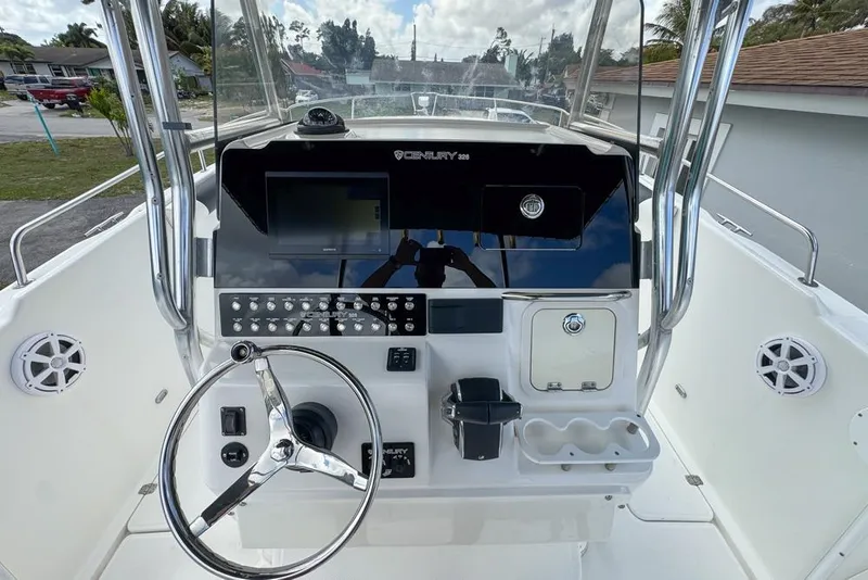 Slide: The Image of Century 3200 Center Console 2000 model, featuring a sleek helm with modern controls. - 28