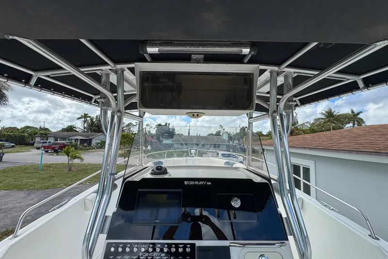Slide: The Image of Century 3200 Center Console boat dashboard, 2000 model, with canopy and control panel. - 32