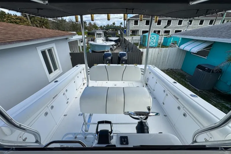 Slide: The Image of 2000 Century 3200 Center Console boat with spacious seating and modern controls. - 37