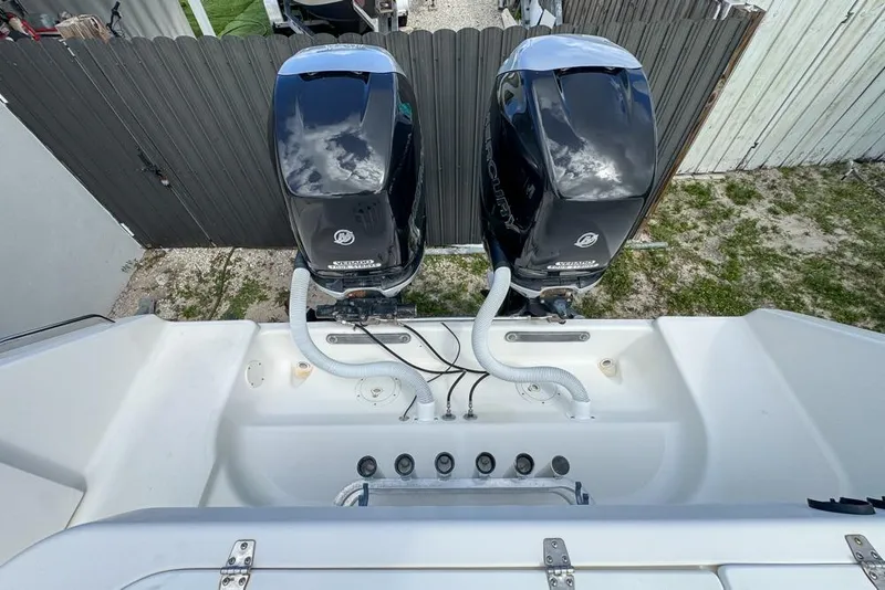 Slide: The Image of 2000 Century 3200 Center Console boat with dual Mercury outboard engines. - 55