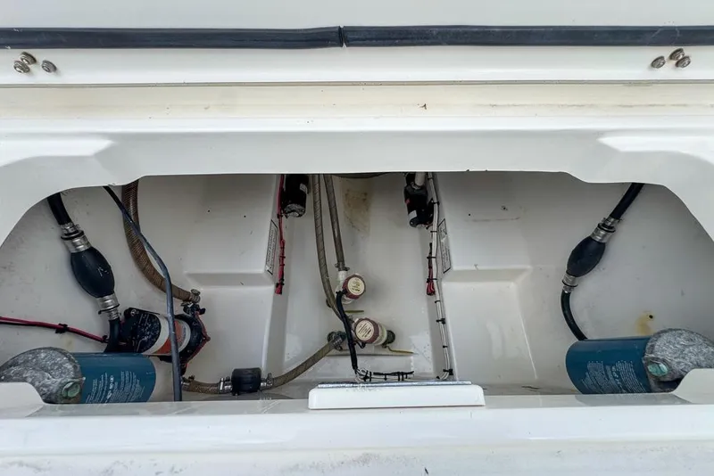 Slide: The Image of 2000 Century 3200 Center Console boat interior with visible wiring and components. - 61