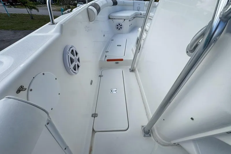 Slide: The Image of 2000 Century 3200 Center Console boat interior with seating and storage compartments. - 73