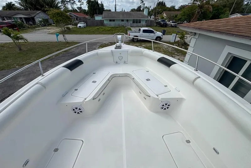 Slide: The Image of 2000 Century 3200 Center Console boat with spacious seating and storage compartments. - 75