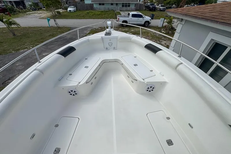 Slide: The Image of 2000 Century 3200 Center Console boat with spacious deck and storage compartments. - 76