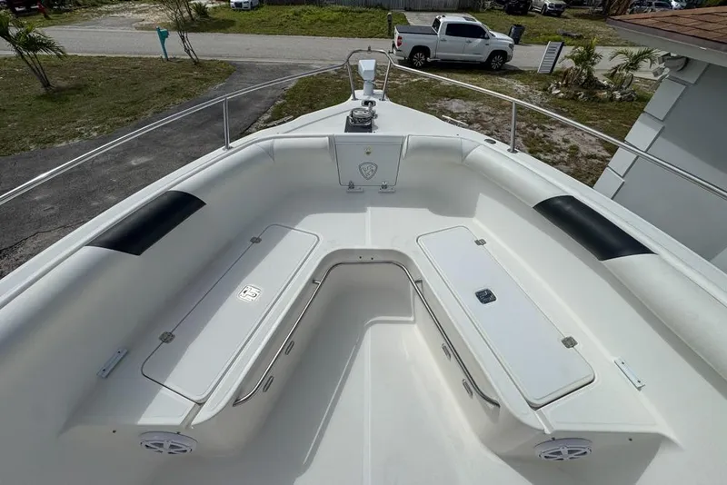 Slide: The Image of 2000 Century 3200 Center Console boat with spacious seating and storage compartments. - 79