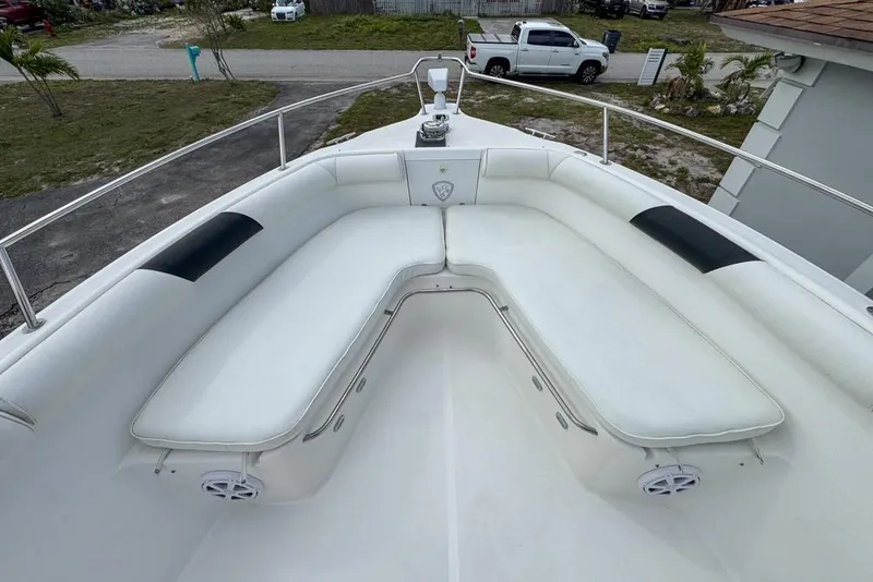 Slide: The Image of Century 3200 Center Console 2000 boat with spacious white seating area and speakers. - 83